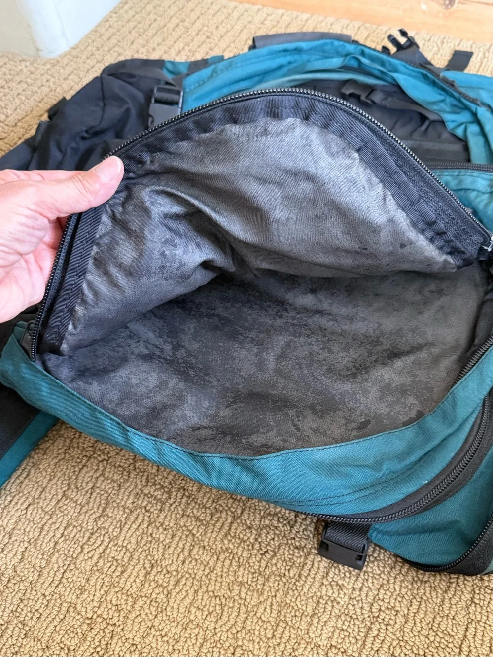 Teal and Black Vintage Eagle Creek Backpack with a day pack attached.